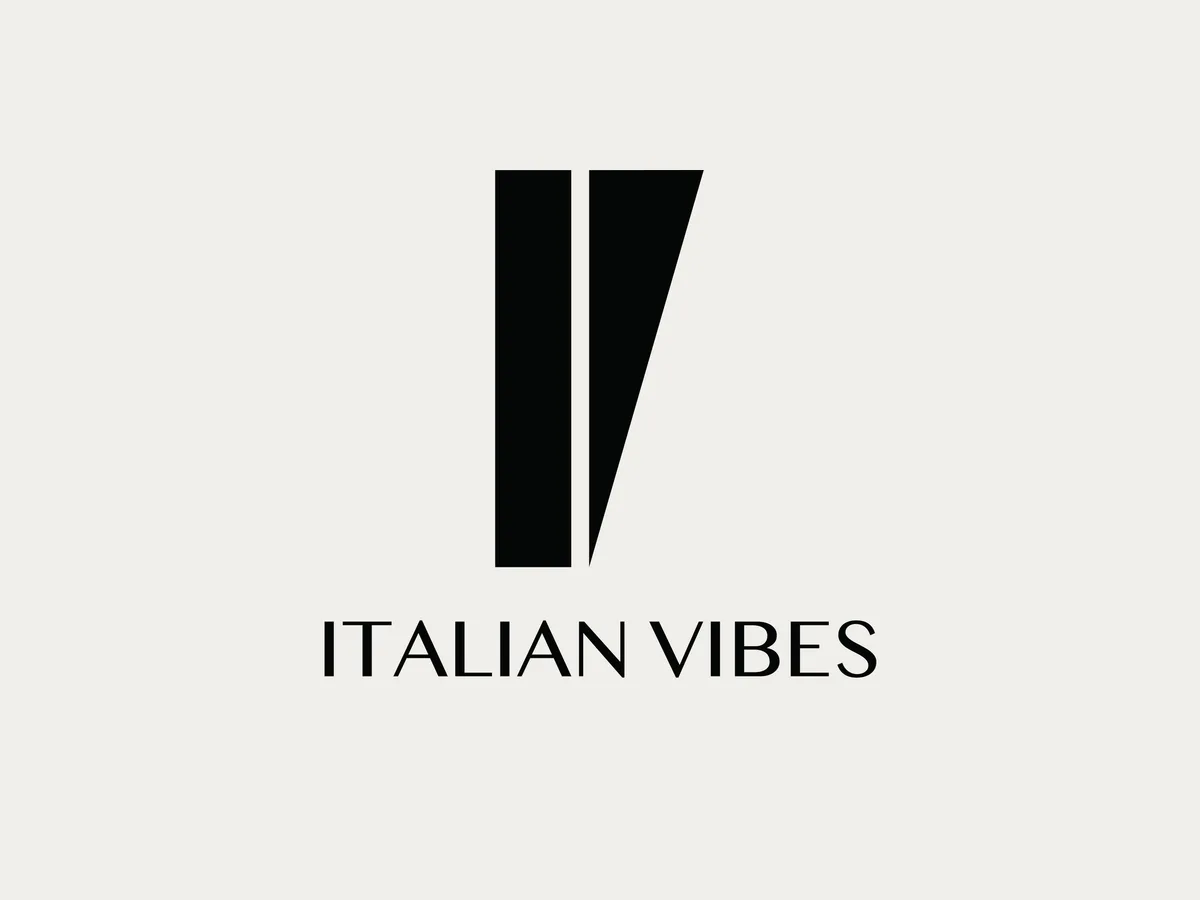 The Italian Vibes mark: two tapering vertical strokes, one straight and one cut to a point, above the name in a high-contrast serif