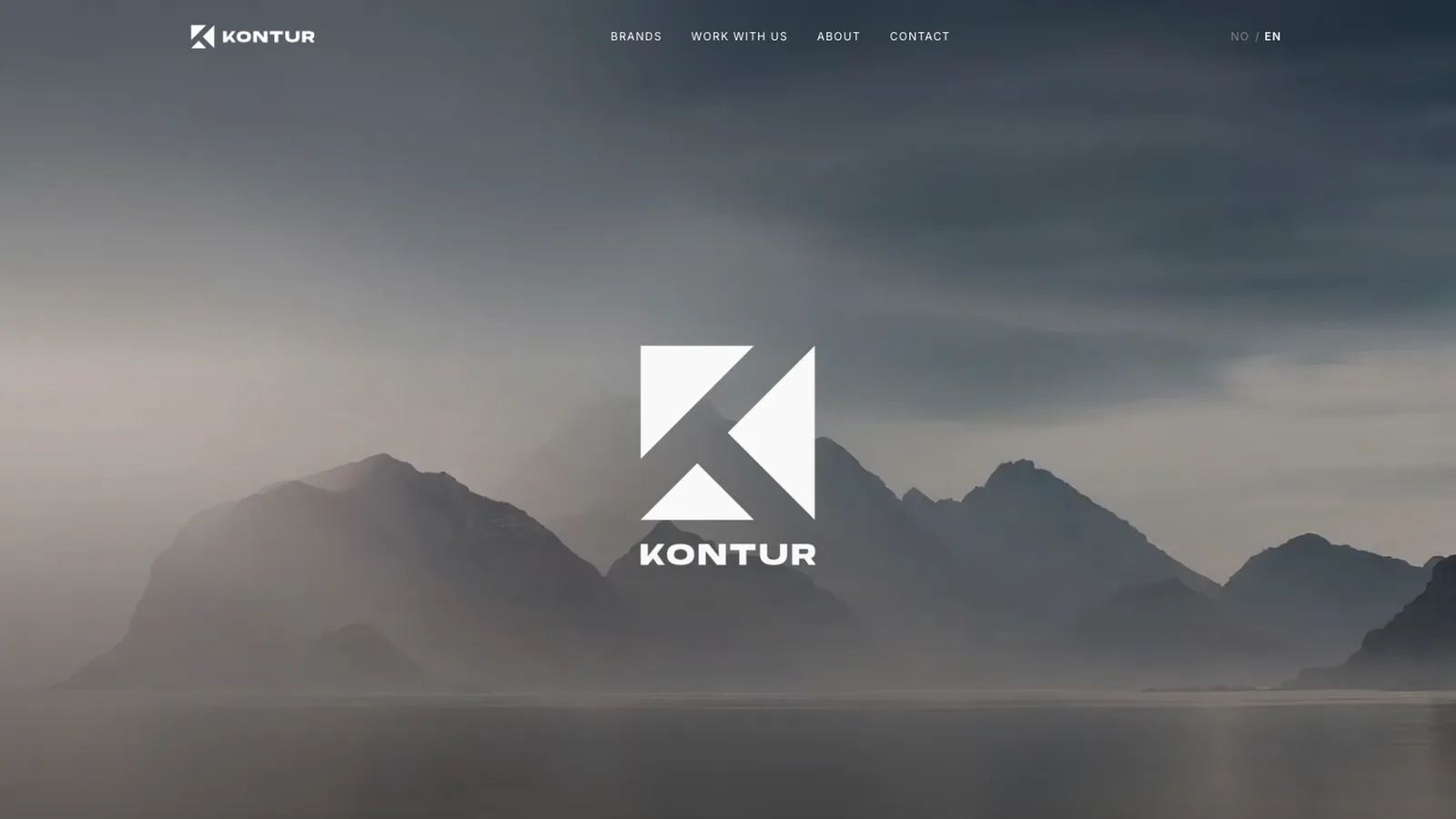 The Kontur Agentur homepage: the Kontur monogram over a misty mountain landscape with a minimal navigation bar